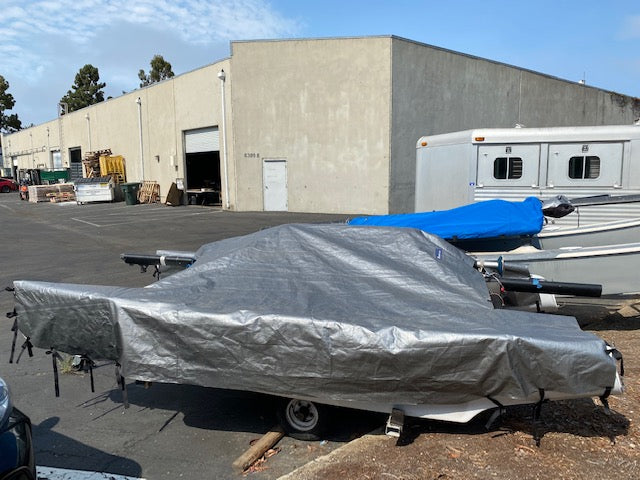 Murrays 1 Piece Econo Boat Cover
Econo covers are economical, lightweight and waterproof. They are basic one-piece catamaran covers that fit loosely and secure with nylon ribbon ties. The econ covers fit multiple catamarans from the Hobie Wave to the Nacra F18. Econo covers provide full coverage and are ideal for use on the beach and in the yard thru the winter.
Materials: The we use a 3-ply polyvinyl material that has a black interior, a fiber laminate core that effectively resists rips, Hobie 16, wave