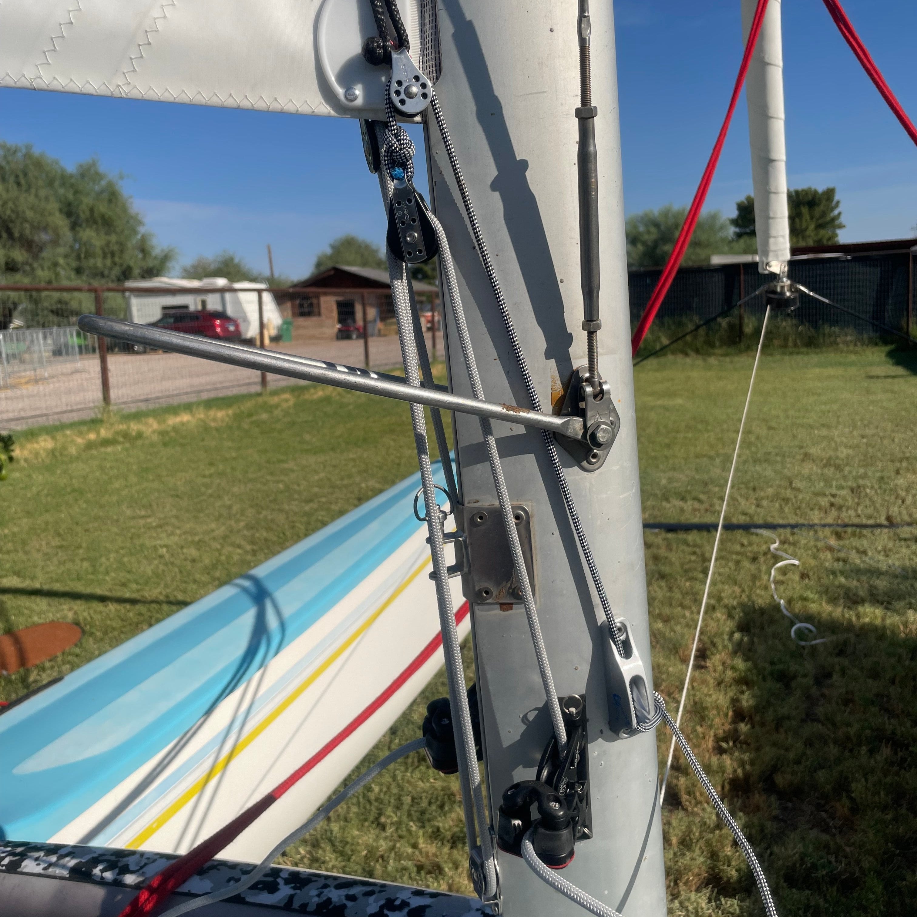 Downhaul Kit 8:1 H18
Murrays Part# 001-2150
This is a performance upgrade downhaul kit that give increased performance control for your Hobie 18 Catamaran. The downhaul leads are run to the side of the boat for crew control and the loads are oriented to reduce sail tack damage that is common on the H18. It takes minutes to install with a rivet gun a drill and approximate measuring.
The kit was born from a discussion at the 2023 NACs wherein many of the boats in Division 4 have a variation of the