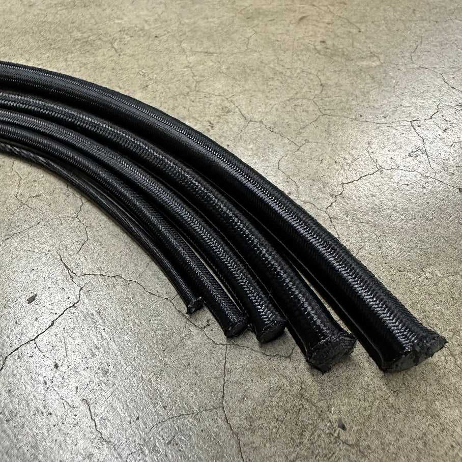 Premium Marine shock cord Use 3/16″ or 1/4″ for trapeze shock cords. Hobie uses #RS014BLK for 1/4″ bungee cord.
Uses: 1/4″ shock cord is primarily used for trapeze shock cord.  
Hobie 16 use 2 x 8′ sections for the trapeze shock cord
Hobie 17 uses one 12′ section for the trap shock cord.
Hobie 18 uses 4 x 7' pieces
Nacra rudder bungees: Factory spec is 4′ of 1/4″ shock cord but it is a common upgrade to use 5/16″
We use 60' of 3/8' in our trampoline bungee lacing kits.