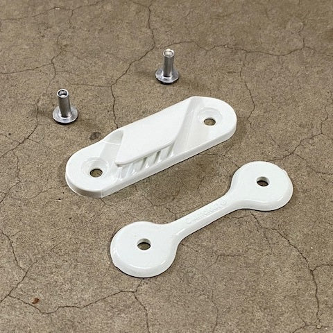 Clamcleat Leech Line Cleat
Murrays Part# 27-0212
Jib halyard tensioning cleat for zippered luff jibs. The low-profile, white nylon Clamcleat® can be sewn or riveted onto sails and technical fabrics. It can be mounted in two positions on the sail.
The tooth design allows a quick, positive lock that is easy to release. It is an ideal cleat for adjusting leech lines. Use a backplate when riveting a cleat onto fabric, as it will prevent the rivet pulling through.
Includes: backing plate and 2x flare rivet