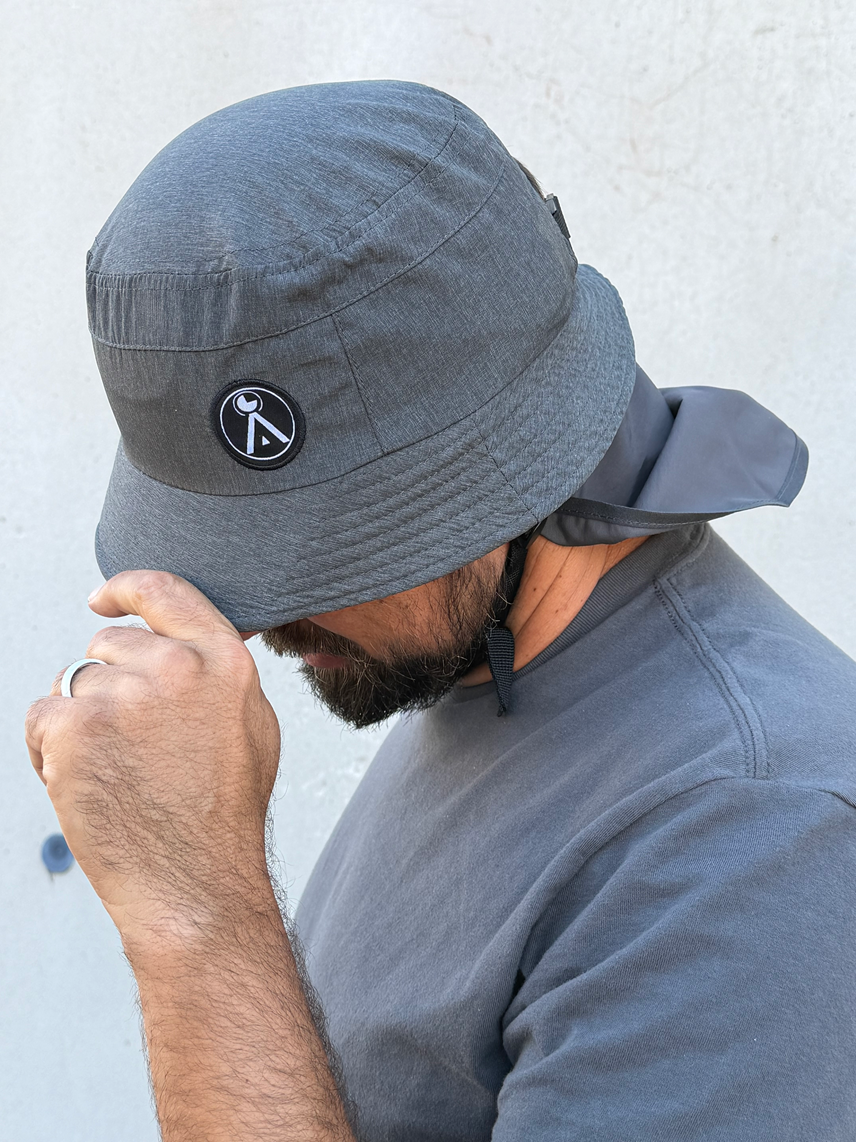 Impact Bucket Hat - Bump Cap

The Surf - Foil Impact Bucket Hat is a bucket hat with a lightweight plastic and foam liner that makes it able to take light to medium impacts. Watersports specific design is great for Surfing, Kitesurfing, Foiling, Sailing, SUP, Kayak, and Windsurfing.

- 360 degree brim with a stiff section in the front to protect your face and eyes from the sun.

- Removable neck flap for additional sun protection

- Chin strap for secure fit

- Padded liner for impact resistance