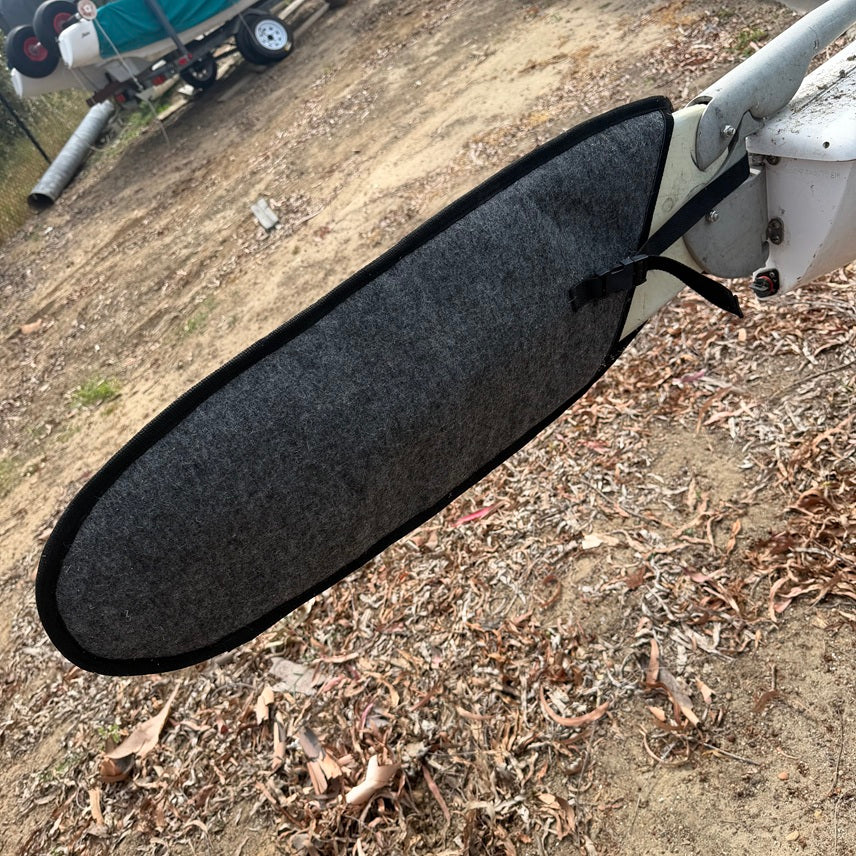 The Murrays rudder covers are constructed of durable, UV stable, padded material to protect your rudders from dings, nicks and grime. The red color helps with visibility when trailering. Straps with sturdy buckles keep the covers firmly in place, even when traveling.

Our covers are made in the USA from a durable and breathable fabric. The carpet helps keep any sand and debris from being pushed into the rudders and the porous fabric allows water to drain and escape! This reduces mold and corrosion.